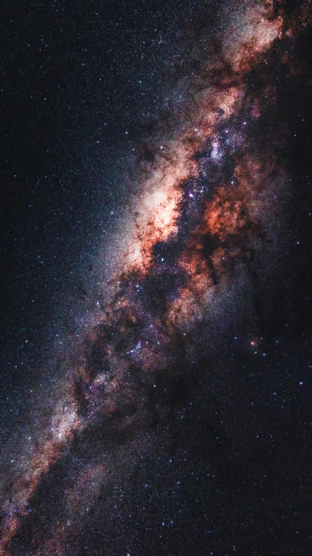 A vibrant view of the Milky Way galaxy with bright stars and colorful cosmic clouds against a dark sky